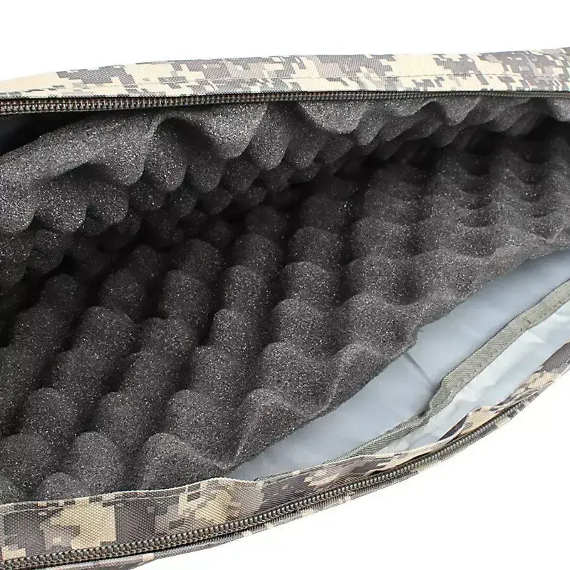 Open tactical gun bag with camouflage exterior and black foam insert for firearm protection.